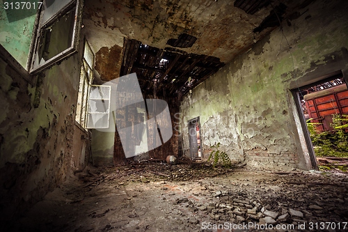 Image of Dark room interior with damaged roof