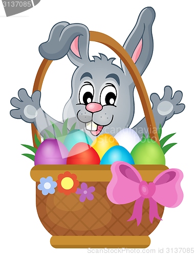 Image of Basket with Easter eggs and happy bunny