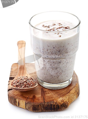 Image of Glass of greek yogurt with crushed flax seeds