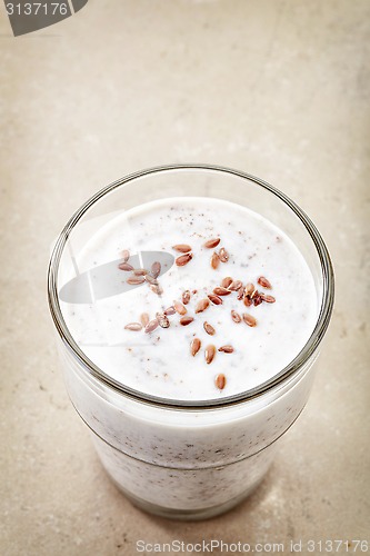 Image of Glass of greek yogurt with crushed flax seeds