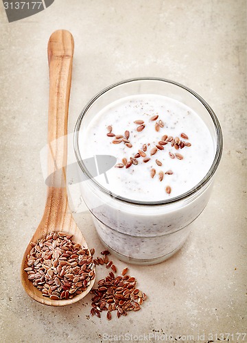 Image of Glass of greek yogurt with crushed flax seeds