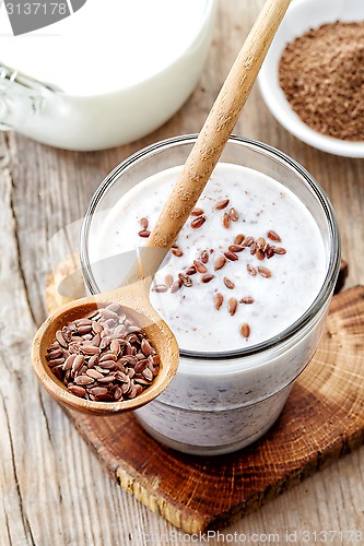 Image of Glass of greek yogurt with crushed flax seeds