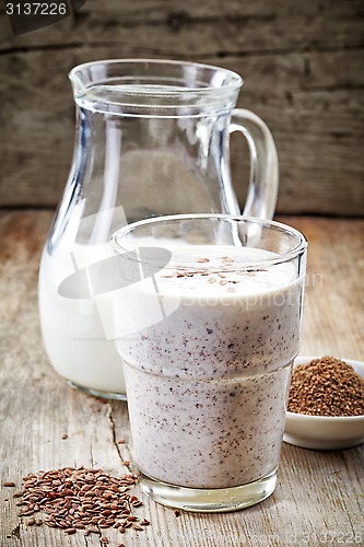 Image of Glass of greek yogurt with crushed flax seeds