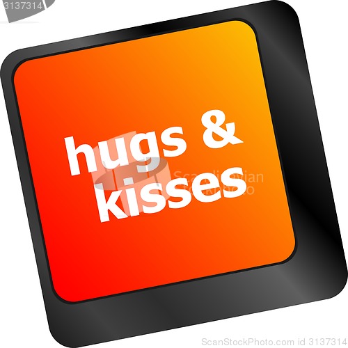 Image of hugs and kisses words on computer keyboard keys