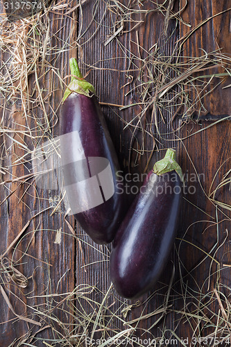 Image of eggplants on wood