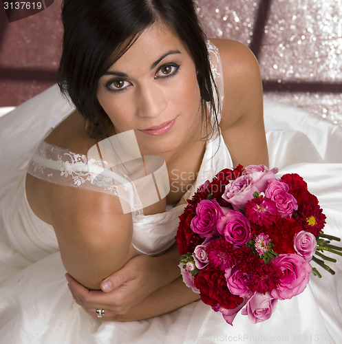 Image of Above Beautiful Female Bride White Gown Holding Floral Bouquet