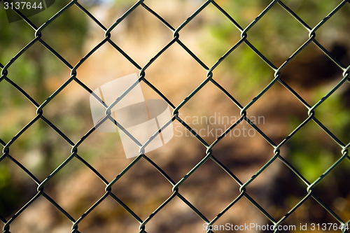 Image of Diagonal Diamond Pattern Chain Link Fence Outside Boundary