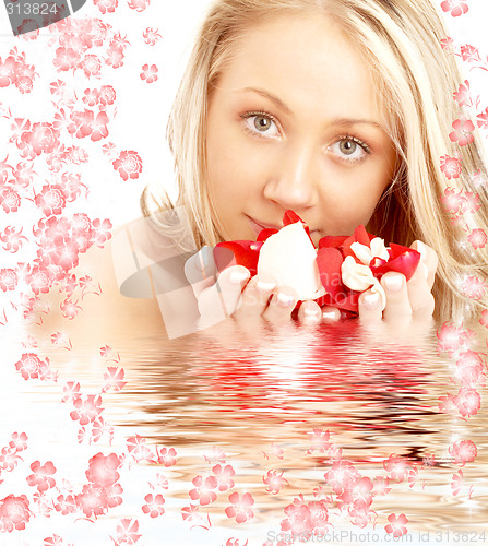 Image of happy blond in water with red and white flowers