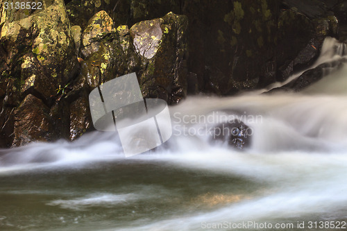 Image of waterfall and rocks covered with moss