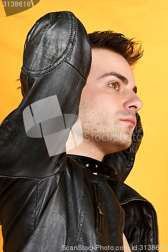 Image of Young man with black leather jacket