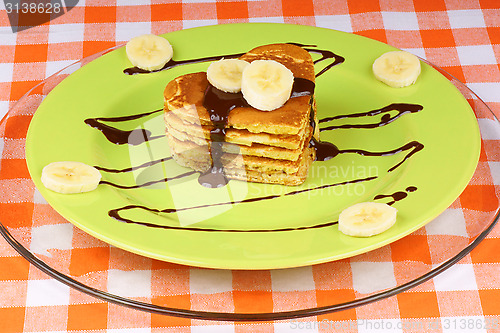 Image of Heart shaped pancakes with chocolate and banana