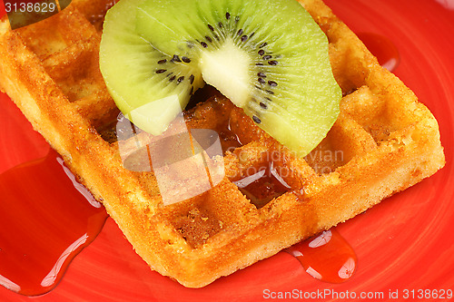 Image of Waffle with kiwi fruit and syrup