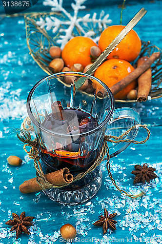 Image of drink mulled wine on bright blue background.