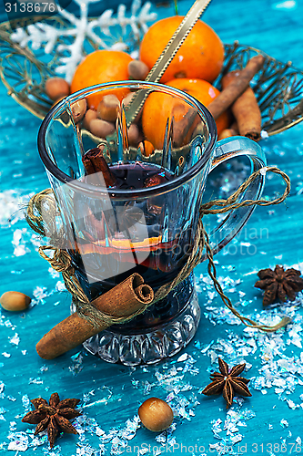 Image of drink mulled wine on bright blue background.