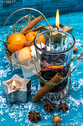 Image of drink mulled wine on bright blue background.