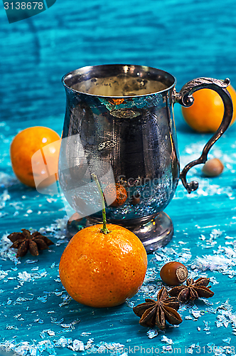 Image of drink mulled wine on bright blue background.