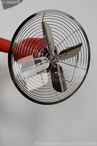 Image of vintage metal fan on neutral background