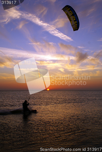 Image of Kite surfing and sunset