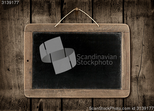 Image of Blackboard on a dark wood wall background