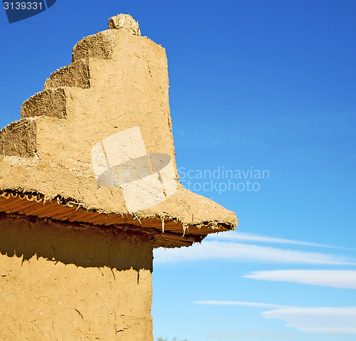 Image of brown old  construction in  africa morocco and  clouds  near the