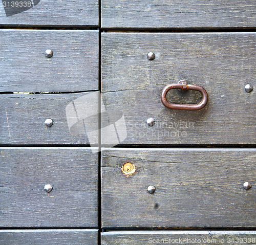 Image of abstract   rusty  in   door curch  closed wood lombardy italy  v