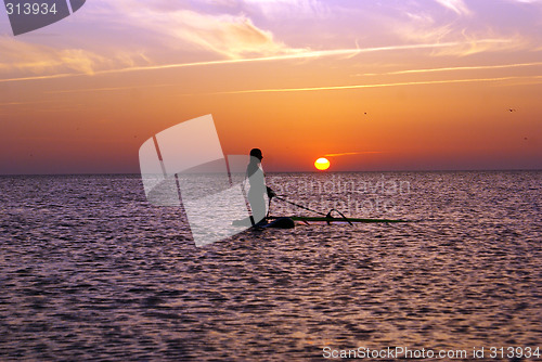 Image of Woman and sunset