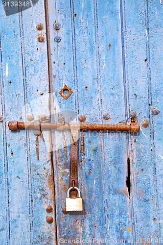 Image of rusty metal   nail dirty  and morocco  