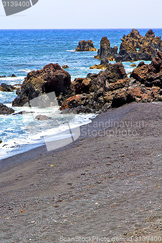 Image of hervideros brown rock in white coast   water   summer 
