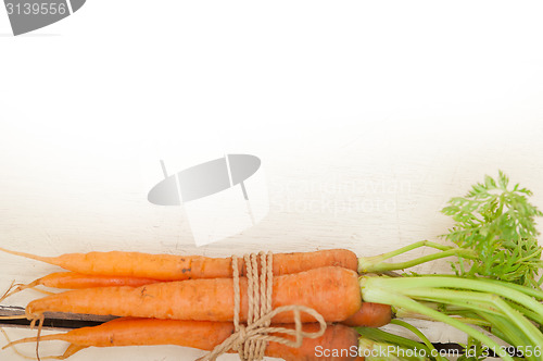 Image of baby carrots bunch tied with rope