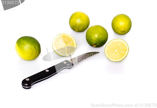 Image of Knife and green fresh limes 