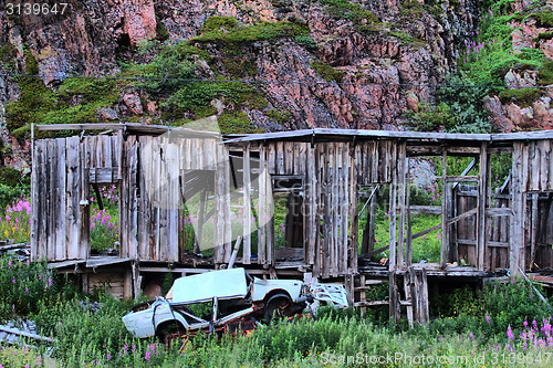 Image of ruins of destroyed an abandoned wooden house