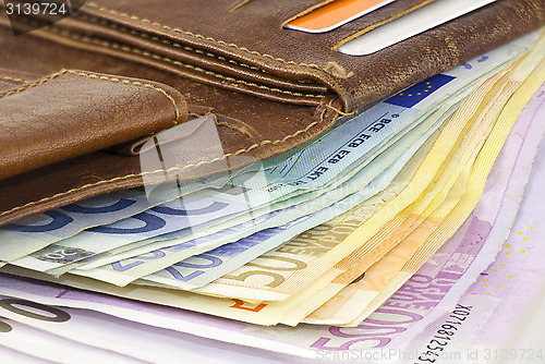 Image of Leather wallet full of Euro banknotes