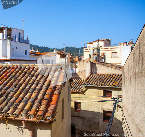 Image of Tossa de Mar, Catalonia, Spain, 06.17.2013, roofs of houses in t