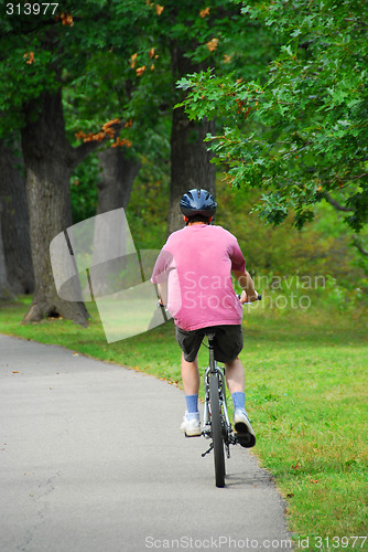 Image of Man bicycling