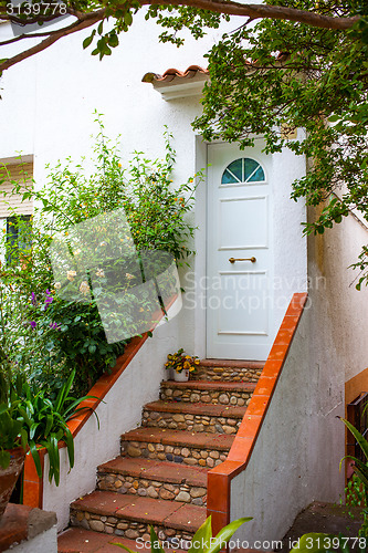 Image of beautiful porch with steps at the front door