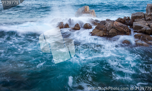 Image of waves of the sea and coastal rocks, surf