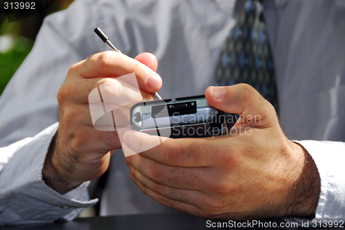 Image of Man hands pda