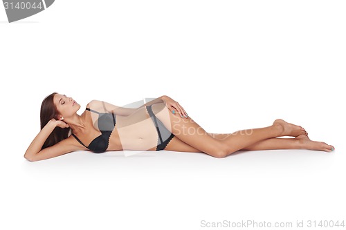 Image of Woman lying down in lingerie