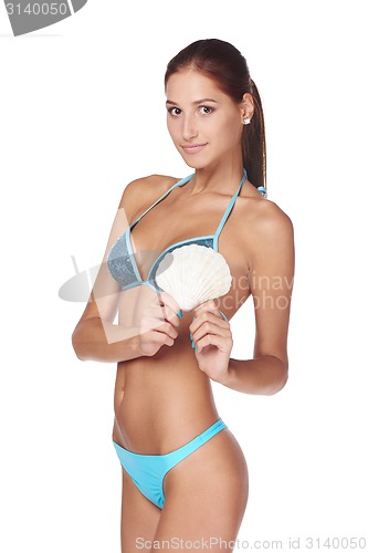 Image of Slim tanned woman in blue bikini