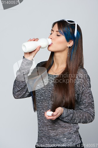 Image of Healthy woman drinking of dairy produce