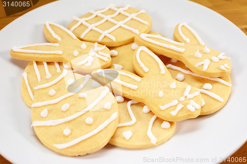 Image of Heap of frosted Easter biscuits on a plate