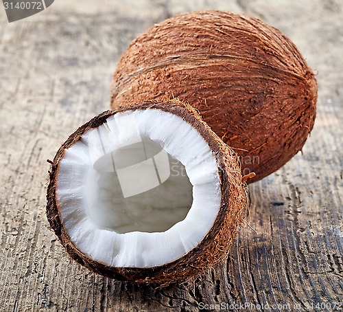 Image of coconut on old wooden table