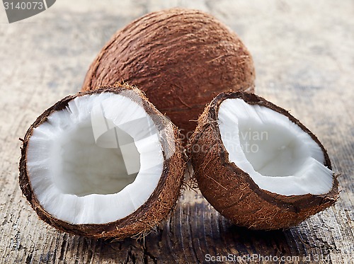 Image of coconut on old wooden table