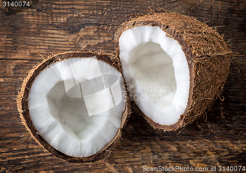 Image of coconut on old wooden table