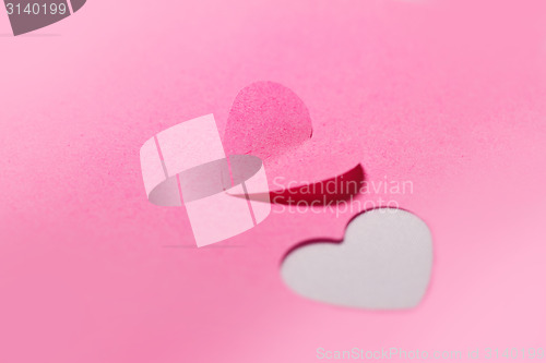 Image of Pink paper hearts and pink background