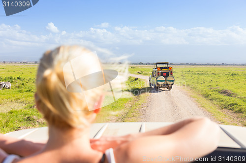 Image of Woman on african wildlife safari.