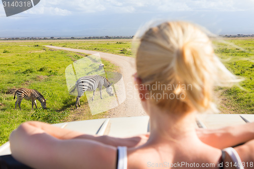 Image of Woman on african wildlife safari.