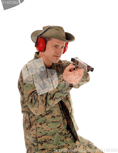 Image of Soldier pointing a pistol.