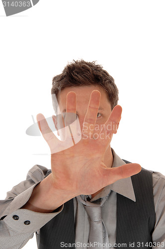 Image of Man holding hand for face.