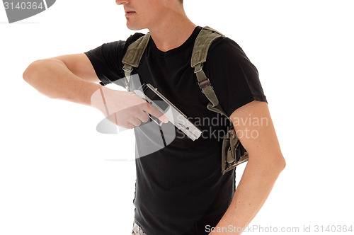 Image of Soldier pulling his handgun.